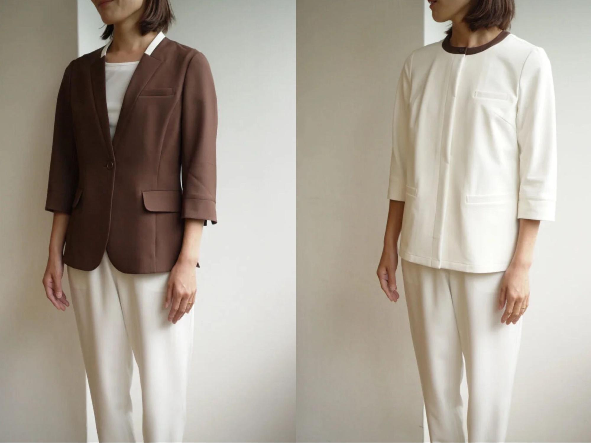 ブラウンのジャケットと白いパンツ、白いブラウスと白いパンツの制服を身につけているクリニックスタッフの女性